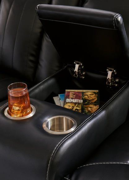 Caveman Den - Power Reclining Loveseat with Console/ Adj Hdrst - Midnight
